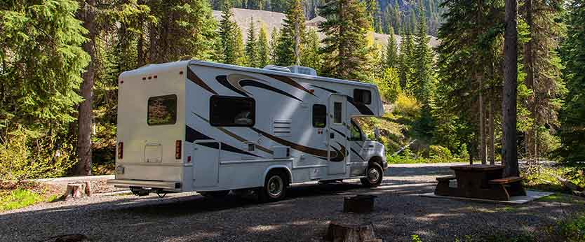 A RV parked at a campsite