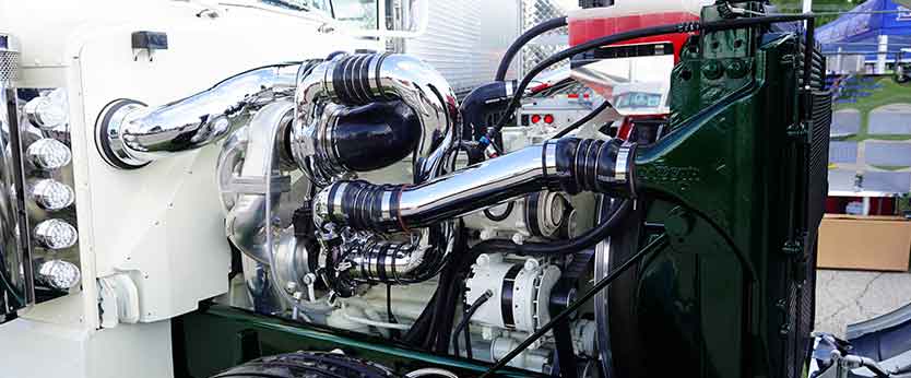 Cummins semi truck with hood up being repaired